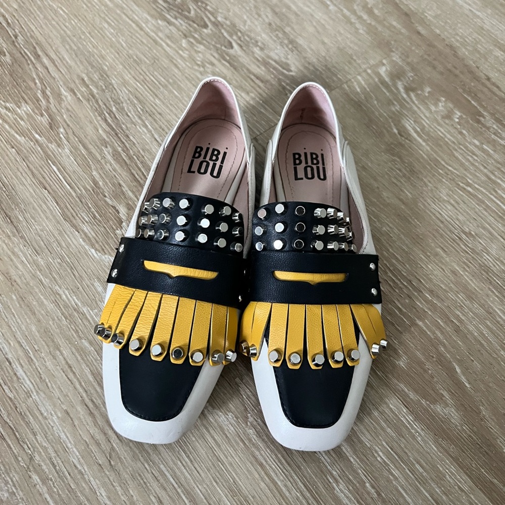 Beige, black and yellow studed leather shoe